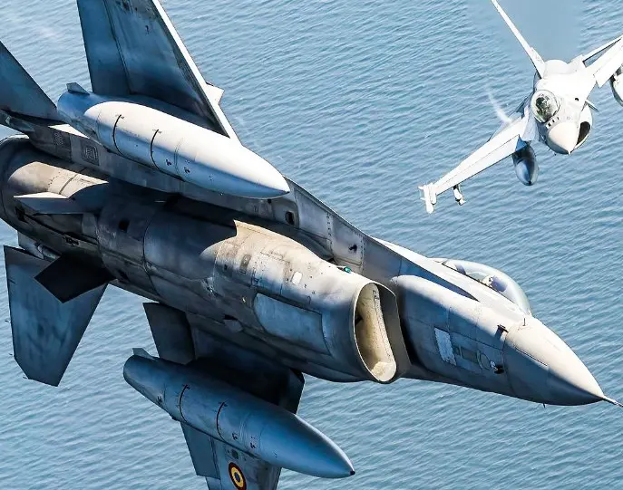 fighter plane in the air with sea below