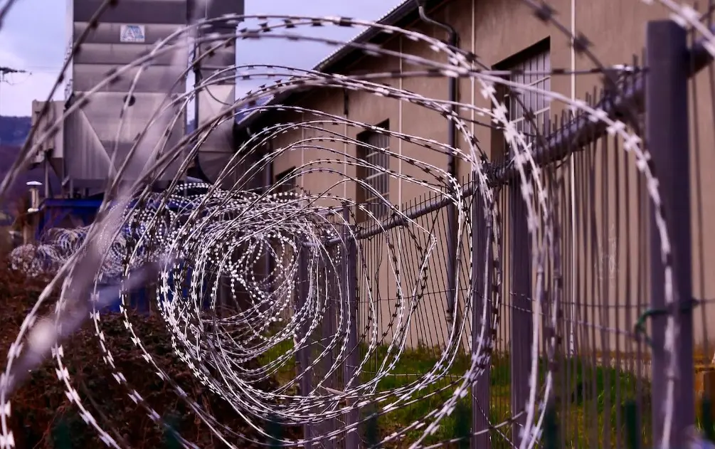 prison fence with razor wire